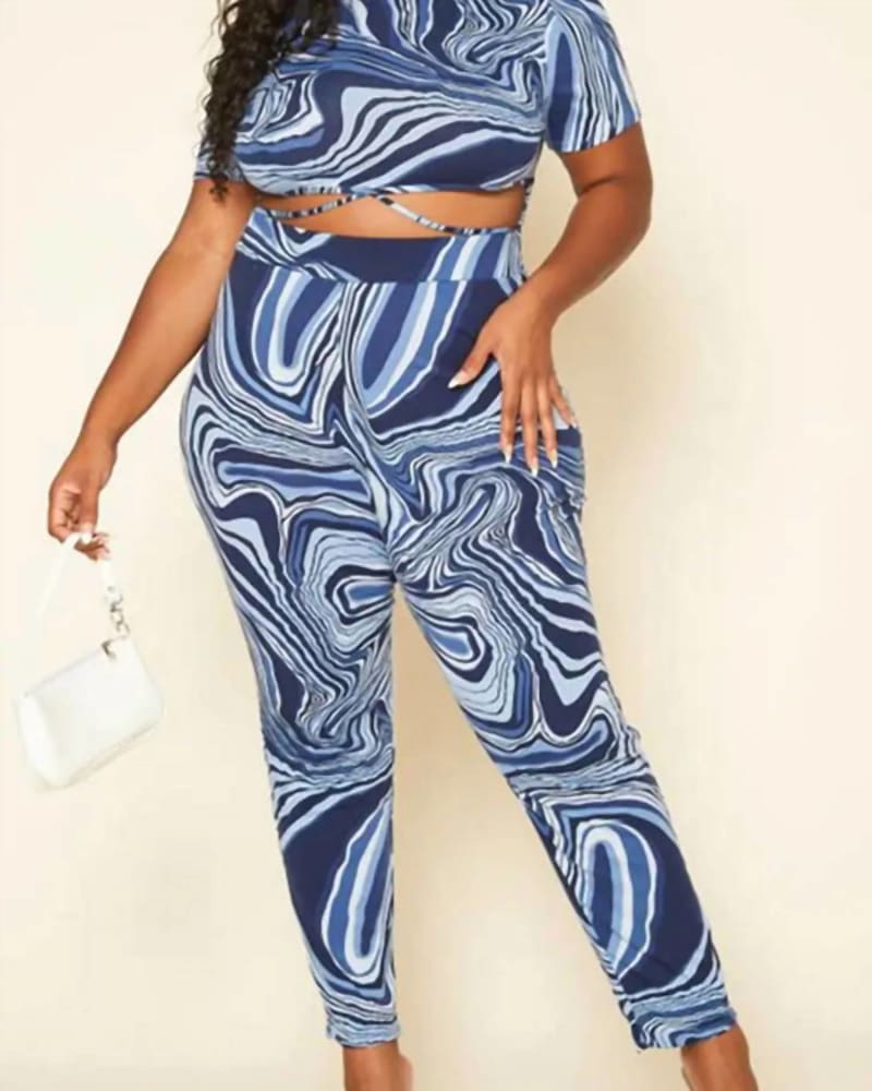 Front of a model wearing a size 1XL Marble Print Cut Out Jumpsuit In Patterned in Patterned by Good Time USA. | dia_product_style_image_id:359530